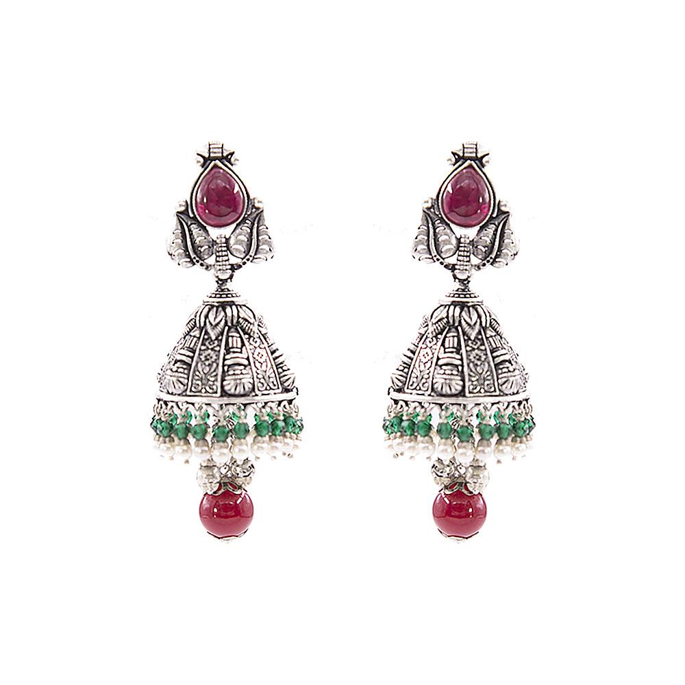 Close-up of Aashna Silver Jhumkas, featuring red kundan, green and red pearls, and temple jewellery dye motifs. These traditional Indian earrings are beautifully designed with vibrant colors and intricate details, adding an elegant touch to any ensemble.