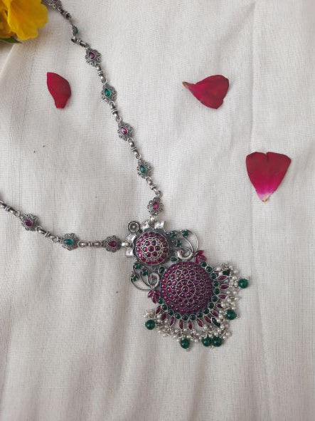 Adwait necklace - A close-up of the Adwait Kundan Rajwadi Silver Heritage Necklace featuring a Ranihaar pendant adorned with beautiful red ruby takkar work. The necklace showcases intricate Kundan craftsmanship and reflects the regal elegance of Indian heritage.