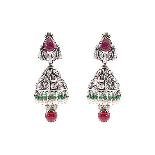 Close-up of Aashna Silver Jhumkas, featuring red kundan, green and red pearls, and temple jewellery dye motifs. These traditional Indian earrings are beautifully designed with vibrant colors and intricate details, adding an elegant touch to any ensemble.